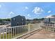 Relaxing outdoor deck with a view of well maintained neighborhood and manicured landscaping at 408 Moondance Dr # C, Gastonia, NC 28054