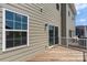 Back deck with light wooden finish, sliding glass door, and outdoor privacy at 408 Moondance Dr # C, Gastonia, NC 28054