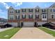 Charming townhome with brick accents, a one-car garage, and a well-manicured lawn at 408 Moondance Dr # C, Gastonia, NC 28054