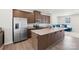 Well-lit kitchen with stainless steel appliances, granite countertops, and a functional island at 408 Moondance Dr # C, Gastonia, NC 28054