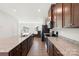 Modern kitchen featuring granite countertops, stainless steel appliances, and dark wood cabinets at 408 Moondance Dr # C, Gastonia, NC 28054