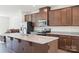 Stylish kitchen featuring stainless steel appliances, granite countertops, and a spacious island at 408 Moondance Dr # C, Gastonia, NC 28054