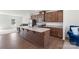 Modern kitchen featuring stainless steel appliances, granite countertops, and a central island at 408 Moondance Dr # C, Gastonia, NC 28054