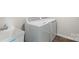 A bright laundry room with modern, front-loading washing machine and utility sink at 408 Moondance Dr # C, Gastonia, NC 28054