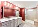 Modern bathroom with double vanity, large mirror, and a glass-enclosed shower at 423 Wescott St # 73, Indian Trail, NC 28079