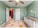 Bright Bedroom featuring light green walls, white crib, and decorative mobile at 423 Wescott St # 73, Indian Trail, NC 28079