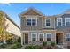 Charming two-story townhome with manicured landscaping and stone accents at 423 Wescott St # 73, Indian Trail, NC 28079