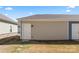 Side view of garage with an access door and exterior lighting at 423 Wescott St # 73, Indian Trail, NC 28079