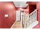 Bright hallway with wood floors and a staircase leading to the upper level at 423 Wescott St # 73, Indian Trail, NC 28079