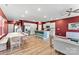 Open-concept living space with hardwood floors, modern lighting, and a spacious kitchen at 423 Wescott St # 73, Indian Trail, NC 28079