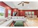Spacious living room featuring hardwood floors, bright red walls, and large sectional sofa at 423 Wescott St # 73, Indian Trail, NC 28079