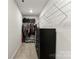 Bright walk-in closet with ample storage space with rack and black dresser at 423 Wescott St # 73, Indian Trail, NC 28079