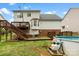 Spacious backyard with a multi-level deck, a fenced yard, and an above-ground pool at 4380 Timberwood Dr, Gastonia, NC 28052