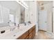Well-lit bathroom with double sinks, granite countertops, and ample cabinet space at 4380 Timberwood Dr, Gastonia, NC 28052