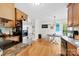 Well-lit kitchen featuring stainless steel appliances and an adjacent dining area with hardwood floors at 4380 Timberwood Dr, Gastonia, NC 28052