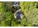 Overhead view of a house emphasizing its roof, driveway, and the surrounding greenery and trees at 4522 Woods End Ln, Charlotte, NC 28277