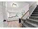 Finished basement with a spacious living area and staircase leading to the upper level at 4522 Woods End Ln, Charlotte, NC 28277