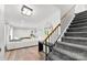 Finished basement with a spacious living area and staircase leading to the upper level at 4522 Woods End Ln, Charlotte, NC 28277