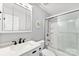 Bright bathroom with a shower-over-tub, a modern vanity, and updated fixtures at 4522 Woods End Ln, Charlotte, NC 28277