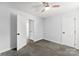 Bedroom with a ceiling fan, neutral carpet, and white walls at 4522 Woods End Ln, Charlotte, NC 28277