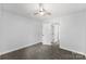 Neutrally decorated bedroom with soft carpet and white door at 4522 Woods End Ln, Charlotte, NC 28277