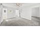 Bright bedroom with neutral carpet flooring and natural light, leading to en suite bathroom at 4522 Woods End Ln, Charlotte, NC 28277