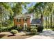 Beautiful brick home surrounded by mature trees, offering a serene and private setting at 4522 Woods End Ln, Charlotte, NC 28277