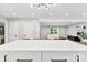 Kitchen island with a marble countertop that looks over an open living space at 4522 Woods End Ln, Charlotte, NC 28277