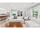 Modern living room featuring a large white sofa, neutral decor, and an open layout at 4522 Woods End Ln, Charlotte, NC 28277