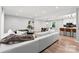 Spacious living area with a comfortable white sofa, open floor plan, and plenty of natural light at 4522 Woods End Ln, Charlotte, NC 28277