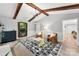 Living room with a white fireplace, modern lights and exposed beams at 4522 Woods End Ln, Charlotte, NC 28277