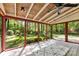 Light-filled sunroom with a wooden ceiling and views of the green yard at 4522 Woods End Ln, Charlotte, NC 28277