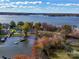 Picturesque aerial view of a lakefront property with mature trees and docks, showcasing the waterfront lifestyle at 4980 Kiser Island Rd, Terrell, NC 28682
