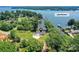 Lake Norman property with stunning waterfront views, sprawling lawn, and a charming single-Gathering home at 4980 Kiser Island Rd, Terrell, NC 28682