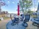 Outdoor dining and seating area on back deck with lake view at 4980 Kiser Island Rd, Terrell, NC 28682