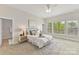 Bedroom featuring a comfortable bed, neutral decor, and bright natural light at 4980 Kiser Island Rd, Terrell, NC 28682