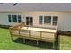Elevated wooden deck featuring lake views, a sliding glass door, and ample seating space at 4980 Kiser Island Rd, Terrell, NC 28682