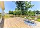 Spacious wooden deck with stylish outdoor furniture, perfect for lakeside entertaining at 4980 Kiser Island Rd, Terrell, NC 28682