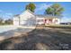 Charming home with a well-maintained lawn, attached two car garage, and a covered front porch at 4980 Kiser Island Rd, Terrell, NC 28682