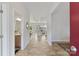 Bright foyer with a view of the living room and half bath features wood floors and neutral paint at 4980 Kiser Island Rd, Terrell, NC 28682