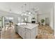 Open concept kitchen with a view of the fireplace, living room, and lake at 4980 Kiser Island Rd, Terrell, NC 28682