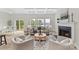 Living room with a fireplace, view of a screened deck, and dining area at 4980 Kiser Island Rd, Terrell, NC 28682