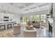 Open-concept living room and kitchen with coffered ceilings and hardwood floors at 4980 Kiser Island Rd, Terrell, NC 28682