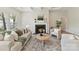 Cozy living room with a fireplace, comfortable seating, and natural light at 4980 Kiser Island Rd, Terrell, NC 28682