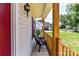 Relaxing front porch with comfortable seating, showcasing a welcoming entrance to the home at 4980 Kiser Island Rd, Terrell, NC 28682