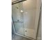 Modern bathroom shower featuring sleek glass doors and white tile at 5205 Mint Harbor Way # 0353, Charlotte, NC 28269