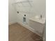 Functional laundry room with a utility sink, shelf, and washer/dryer hookups at 5205 Mint Harbor Way # 0353, Charlotte, NC 28269