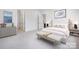 Bright primary bedroom with modern furniture, neutral color palette, and wall art, creating a calming and inviting space at 5205 Mint Harbor Way # 0353, Charlotte, NC 28269