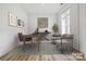 Well-lit home office featuring a modern desk, comfortable seating, and a large window for natural light at 5205 Mint Harbor Way # 0353, Charlotte, NC 28269