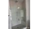 Spa-like shower with wave tile, glass enclosure, and built-in bench seating at 5205 Mint Harbor Way # 0353, Charlotte, NC 28269